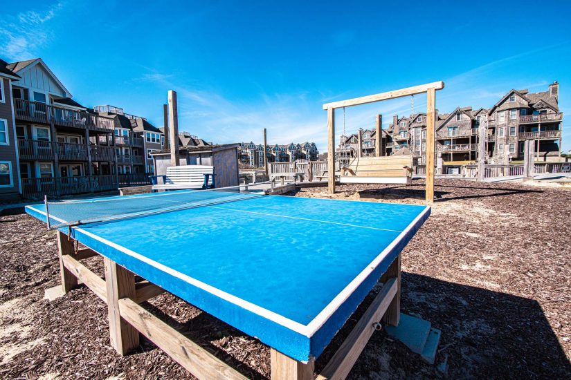Photo of outdoors ping pong table.