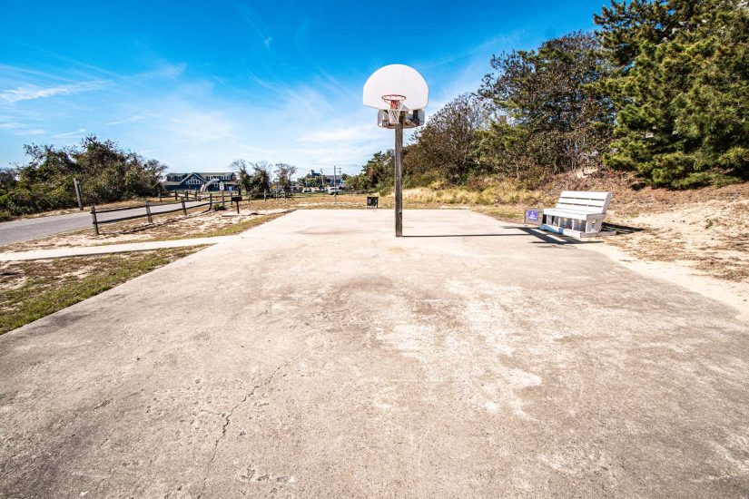 Photo of outdoors basketball court.