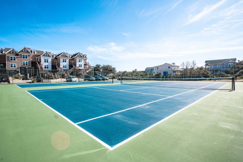 Outdoors tennis court.